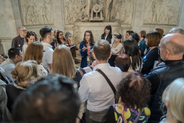 Tour guide inside st paul's cathedral with tourists